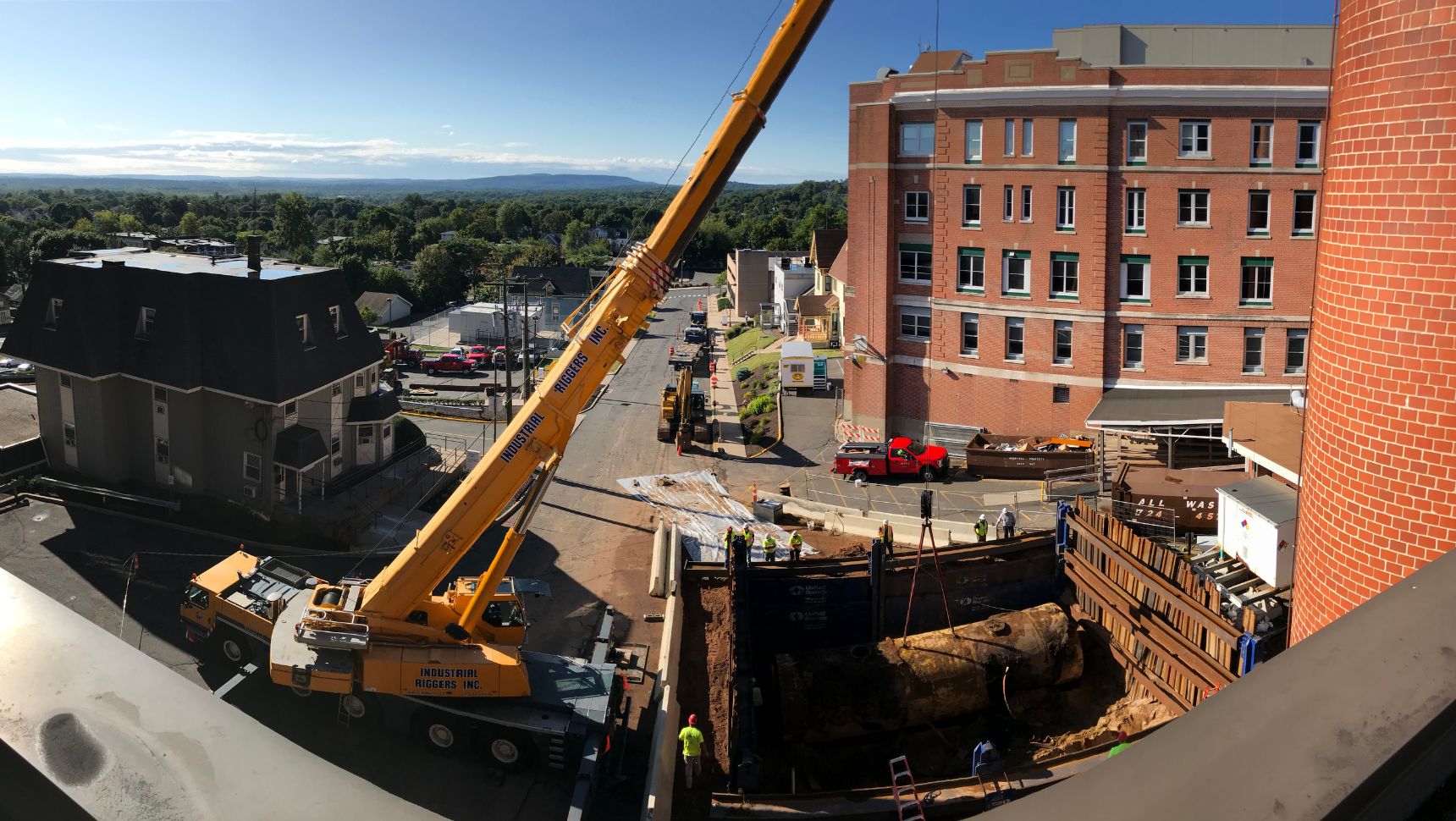 Wide angle view of tank being removed