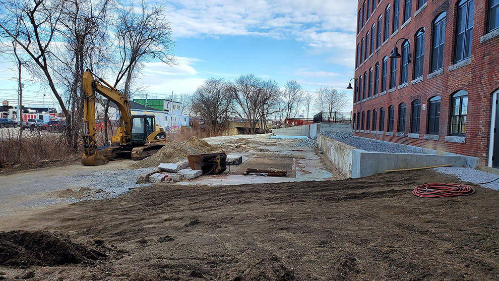 Construction equipment next to building