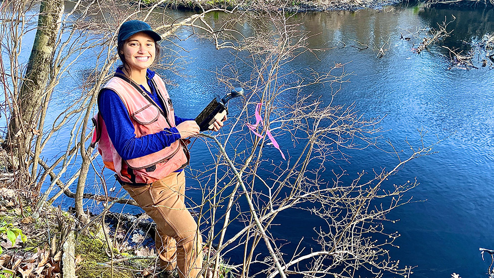 Fuss & O'Neill environmental engineer performing water monitoring