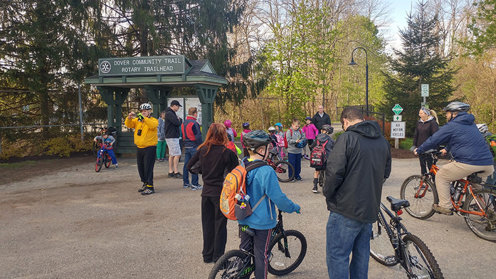 Up a Dover community trail rotary trail head with a group of the bike riders