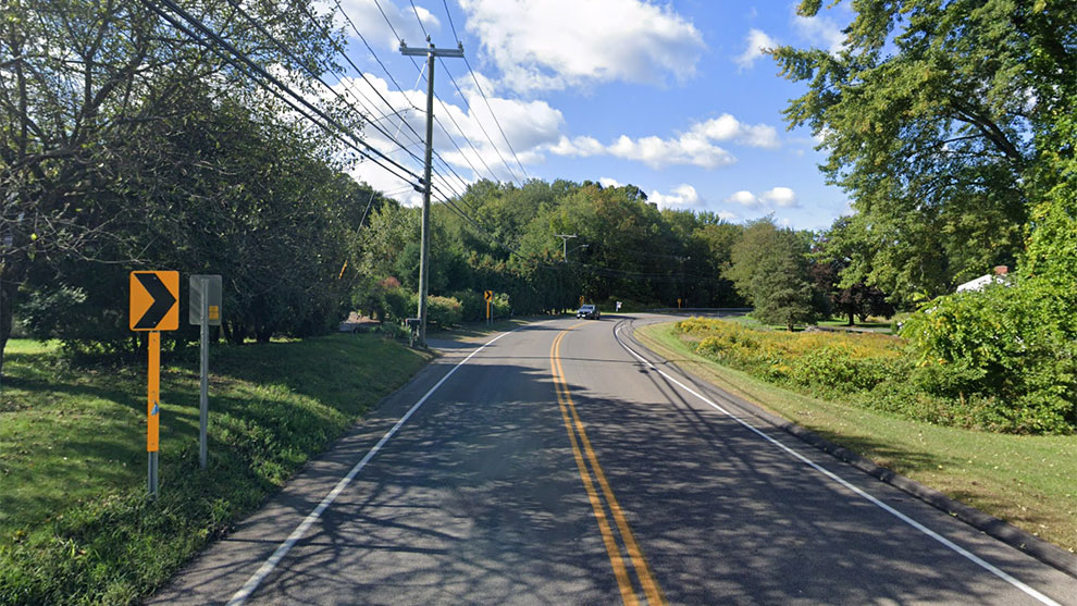 Paved road heading into a curve