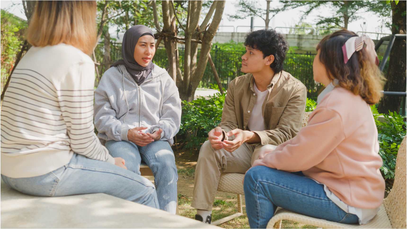 Four people sitting around chatting