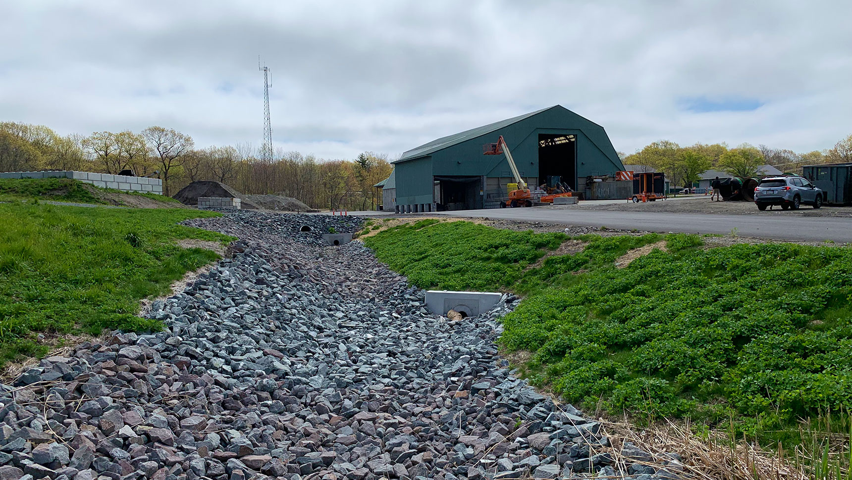 view of building drainage and parking lot