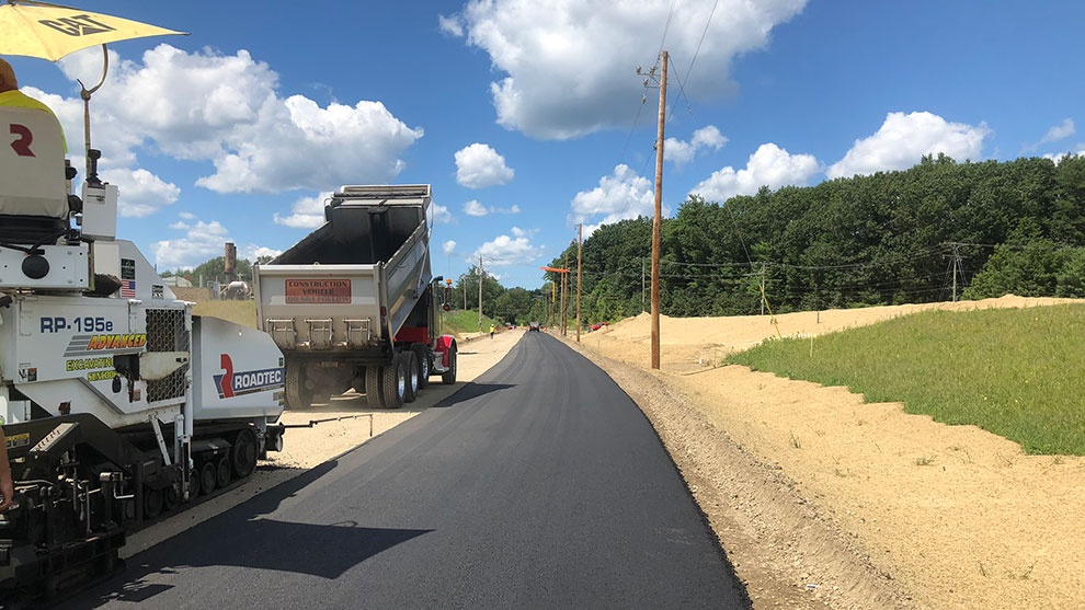 Dump truck and paving equipment