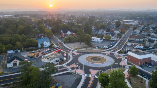 Aerial view of six corners roundabout with sun setting